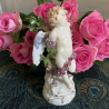 Meissen Porcelain Figure of Cupid Tied up with a GarLand of Roses