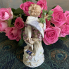 Meissen Porcelain Figure of Cupid Tied up with a GarLand of Roses