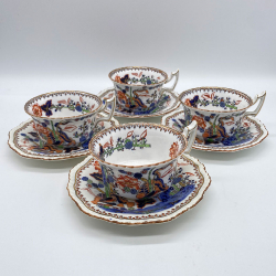 Coalport Porcelain Set of Four Cups and Sauces Decorated With Oriental Scene