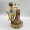 Meissen Porcelain Figure of Cupid Holding the Wreath Above the Doves