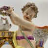 Meissen Porcelain Figure of Cupid Holding the Wreath Above the Doves