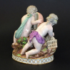 Meissen porcelain figurine of group, two putti playin the large mask