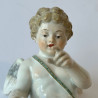 Meissen Porcelain Figure of Cupid Capturing A Heart with Blue Ribbon