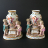 Pair of Meissen Porcelain Figural Vases with three putti
