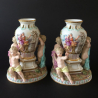 A Pair of Meissen Porcelain Figural Vases with three putti