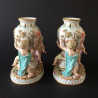 Pair of Meissen Porcelain Figural Vases with three putti
