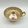 Cauldon China Trio, Decorated with hand Painted Flowers and Gold Leaves